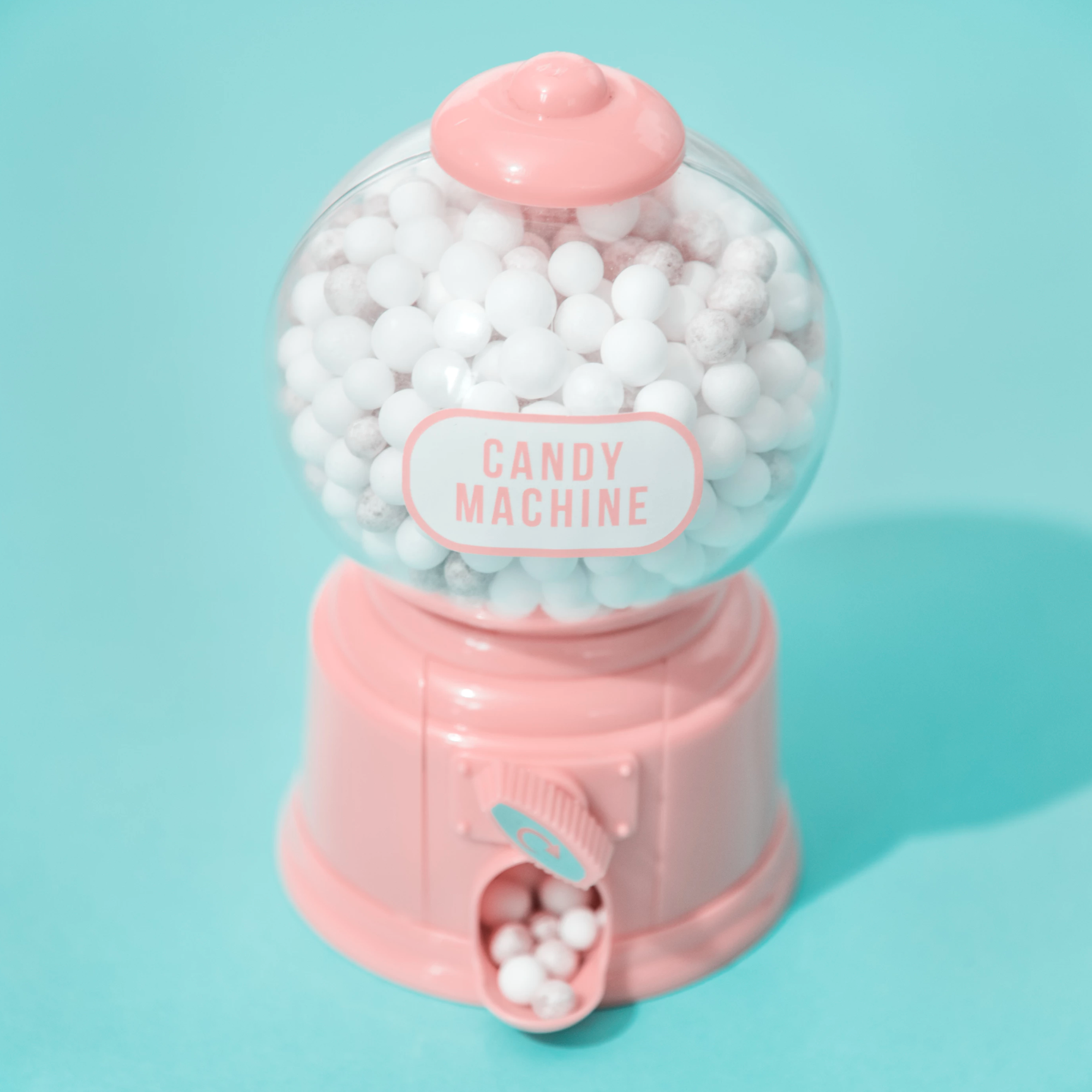 gumball machine full of white gumballs