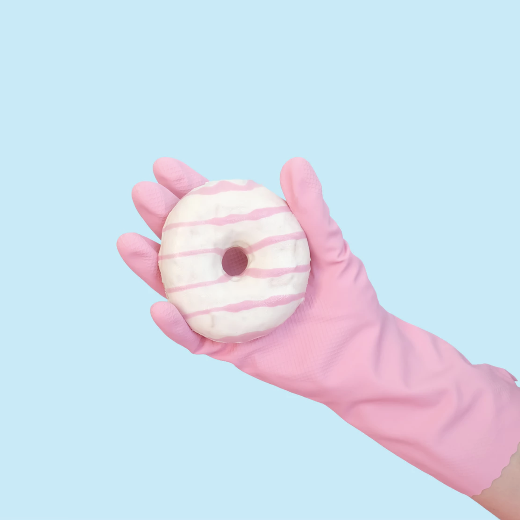 doughnut in a gloved hand